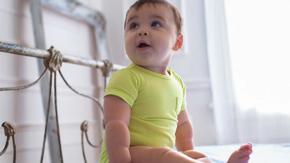 smiling teenage girl holding a goPro camera.