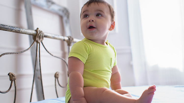 smiling teenage girl holding a goPro camera.