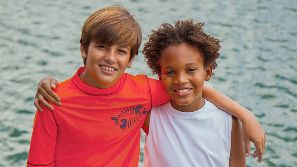 two healthy boys smiling.