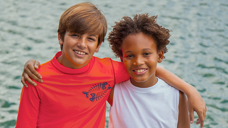 two healthy boys smiling.