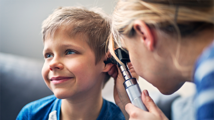 boy receiving ear exam.