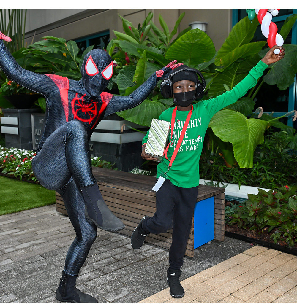 spiderman character posing with patient.